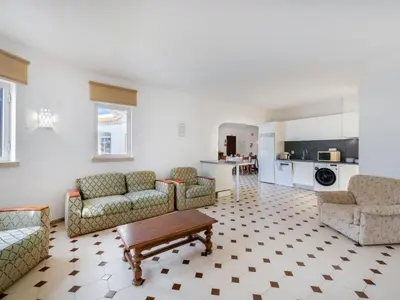 a living room with couches and a fireplace at Apartment T3 capricórnio - VIP Properties by Interhome in Galé