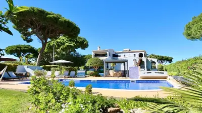 a patio with a table with a laptop on it at Villa Linda Rosa, CD 302 by Cleverdetails private pool, prime location in Vilamoura