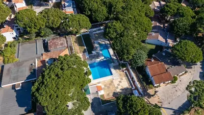 an overhead view of a house with a swimming pool and trees at Açoteias Studio w Pool by LovelyStay in Albufeira