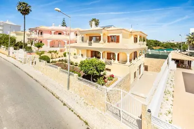 a house on the side of a street at Villa Alice Albufeira in Albufeira