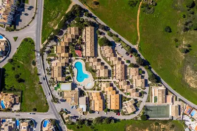 an aerial view of a house with a tennis court at Ponta Grande Resort - Vila Luzia in Albufeira