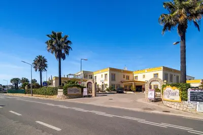 an overhead view of a city with houses and a road at Ponta Grande Resort - Vila Luzia in Albufeira