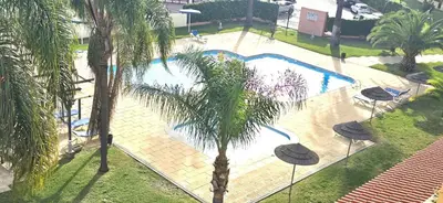 an overhead view of a swimming pool with palm trees at Centre View in Albufeira