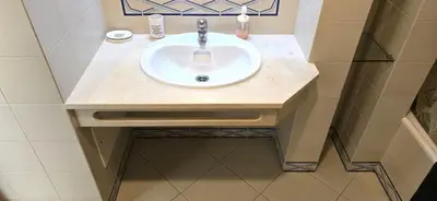 a bathroom with a white sink in a room at Centre View in Albufeira