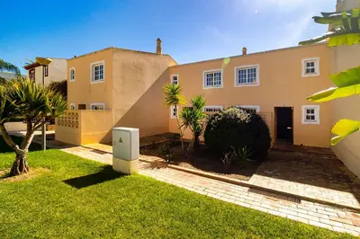 a bathroom with a sink and a mirror at Ponta Grande Resort - Villa Ponta in Albufeira