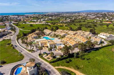 an aerial view of a residential neighborhood with houses at Ponta Grande Resort - Villa Solmar in Albufeira