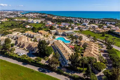 an aerial view of a resort with a pool at Ponta Grande Resort - Villa Atlântica in Albufeira