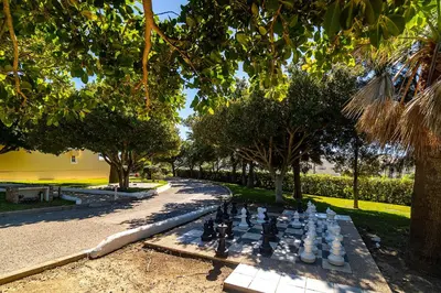 a chess board in the middle of a park at Ponta Grande Resort - Villa Atlântica in Albufeira