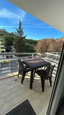 a table and two chairs sitting on a balcony at Pórtico de Malpique in Albufeira
