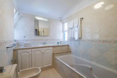 a bathroom with a tub and a sink at Villa Gabriella - Charming villa in great location close to everything you need in Guia
