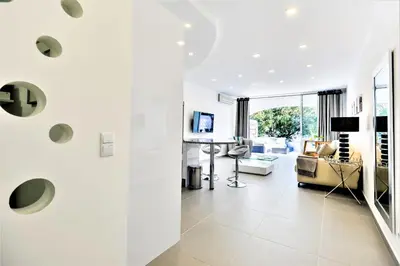 a living room with a couch and a table at Vale do Lobo Apartment in Vale do Lobo