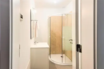 a bathroom with a shower and a sink at Vale do Lobo Apartment in Vale do Lobo