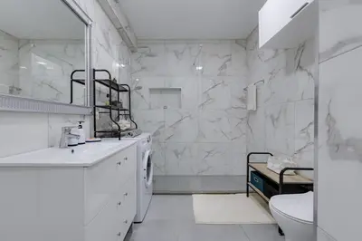 a white bathroom with a sink and a toilet at BELLAVISTA STUDIO - Modern and Renovated near Fishermen's Beach in Albufeira