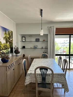 a bedroom with a bed with two towels on it at Apartamento A11 - 800m da praia in Albufeira