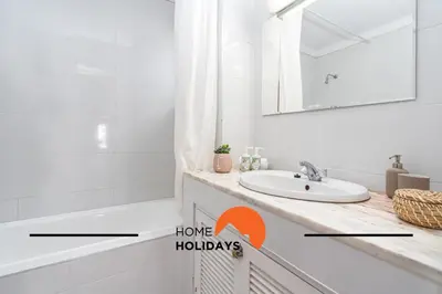 a bathroom with a sink and a mirror at #279 T2 Para Relaxar em Albufeira by Home Holidays in Albufeira