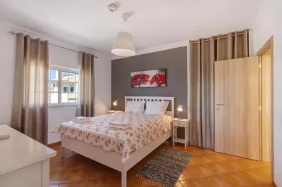 a bedroom with a bed and a window at Breeze Villa - Adults Only in Albufeira