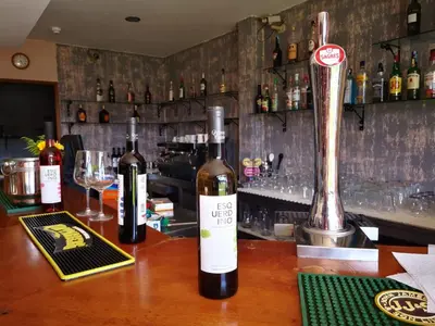 three bottles of wine sitting on a bar at Solar dos Vilarinhos - By bedzy in Albufeira