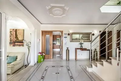 a living room with a couch and a glass floor at Villa Caty Catarina in Albufeira