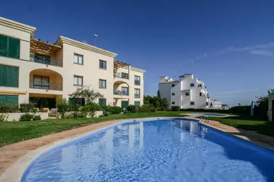 a swimming pool in front of some buildings at FLH Olhos D' Água Apartment with Pool in Albufeira