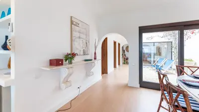 a dining room with a table and chairs at Villa Casa Amendoeiras by LovelyStay in Albufeira