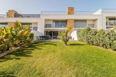 a large yard in front of a building at Family Villa 3 Bedrooms private rooftop with Pool in Albufeira