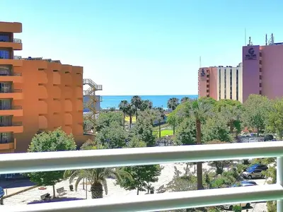 a view of a city with palm trees and buildings at MarinaMar Vilamoura Sea View in Quarteira
