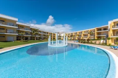 a large swimming pool in front of a building at Albufeira Marina Gardens AO in Albufeira