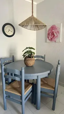 a blue table and chairs with a potted plant on it at Apartamento Flor de Amendoeira Mar in Albufeira
