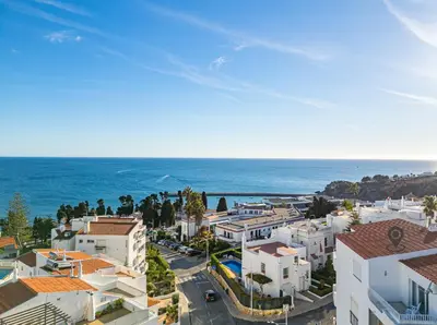 an aerial view of a city and the ocean at Atlantic Apartment in Albufeira