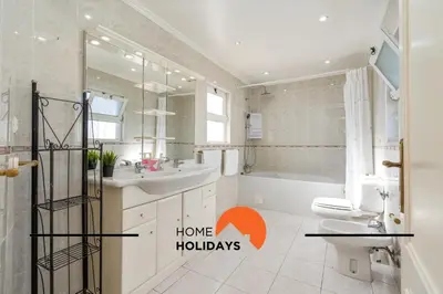 a bathroom with a toilet and a window at #278 Fonte dos Leoes by Home Holidays in Albufeira