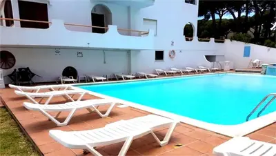 a swimming pool at or near hotel la villa at Sardinha Beach House in Olhos de Água