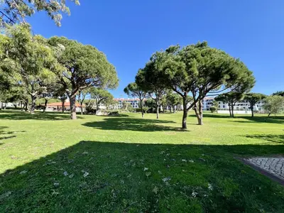 a park with trees and green grass and a path at Vilamoura Sunny Garden With Pool by Homing in Vilamoura