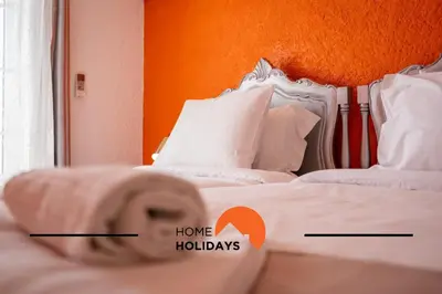 a bedroom with two beds with the words home holidays at #288 Vivenda 3 Palmeiras 57 by Home Holidays in Albufeira
