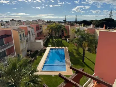 a view of a pool from a balcony of a apartment at Old Village Prestige - Vilamoura in Vilamoura