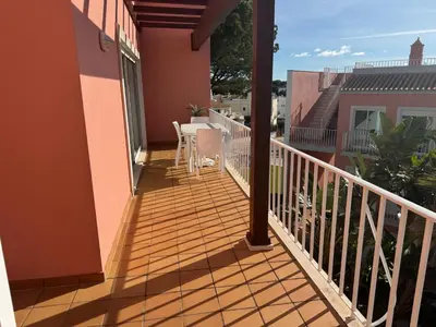 a balcony with a table and chairs on it at Old Village Prestige - Vilamoura in Vilamoura