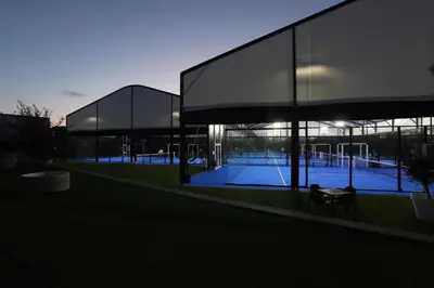 a building with two tennis courts inside of it at Albufeira Lounge Hotel in Albufeira