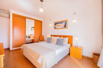 a bedroom with a large white bed in a room at Solarium Luxury Apartment by Atlantic Places in Albufeira