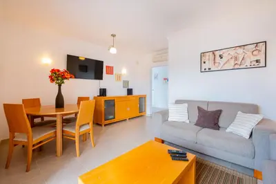 a living room with a couch and a table at Solarium Luxury Apartment by Atlantic Places in Albufeira