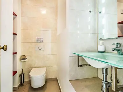 a bathroom with a sink and a toilet at Holiday Home Praia V5 VIP Properties by Interhome in Vilamoura
