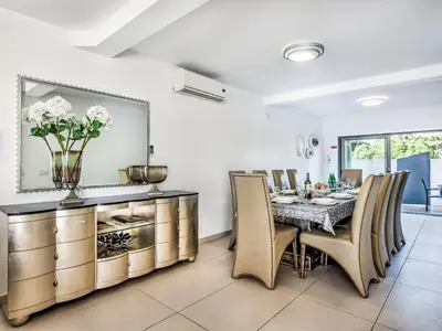 a dining room with a table and chairs at Holiday Home Praia V5 VIP Properties by Interhome in Vilamoura