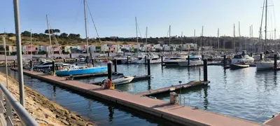 a bunch of boats docked in a harbor at Pateo Apartment - One Bedroom in Albufeira in Albufeira