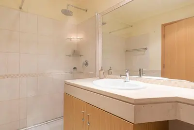 a bathroom with a sink and a shower at Vista Das Ondas 308 By RS in Olhos de Água