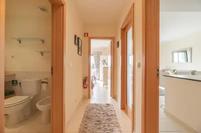 a bathroom with a toilet and a sink at Vista Das Ondas 308 By RS in Olhos de Água