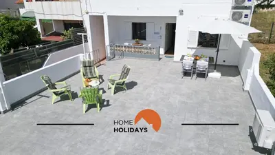 a patio with chairs and a table on a house at #241 Old Town - Casa de Albufeira 1 by Home Holidays in Albufeira