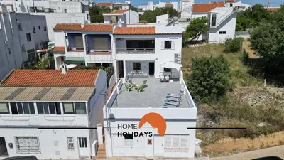 a house with a home improvements sign on it at #241 Old Town - Casa de Albufeira 1 by Home Holidays in Albufeira