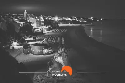 a black and white photo of a city at night at #241 Old Town - Casa de Albufeira 1 by Home Holidays in Albufeira
