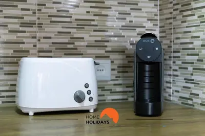 a wiimote next to a toaster and a toaster at #287 Rodrimar Studio 212 by Home Holidays in Albufeira