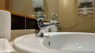 a bathroom sink with a faucet on top of it at Apartment Josefa in Albufeira