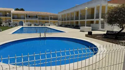 a large swimming pool in front of a building at Apartment Josefa in Albufeira