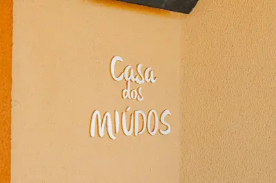a bedroom with a large bed with two tables at Casa da Praia by OCvillas in Albufeira